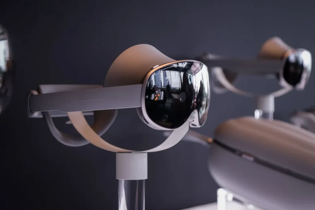 Android XR headset glowing with blue light, surrounded by floating app icons like YouTube, Chrome, and Maps, symbolizing advanced mixed reality technology.