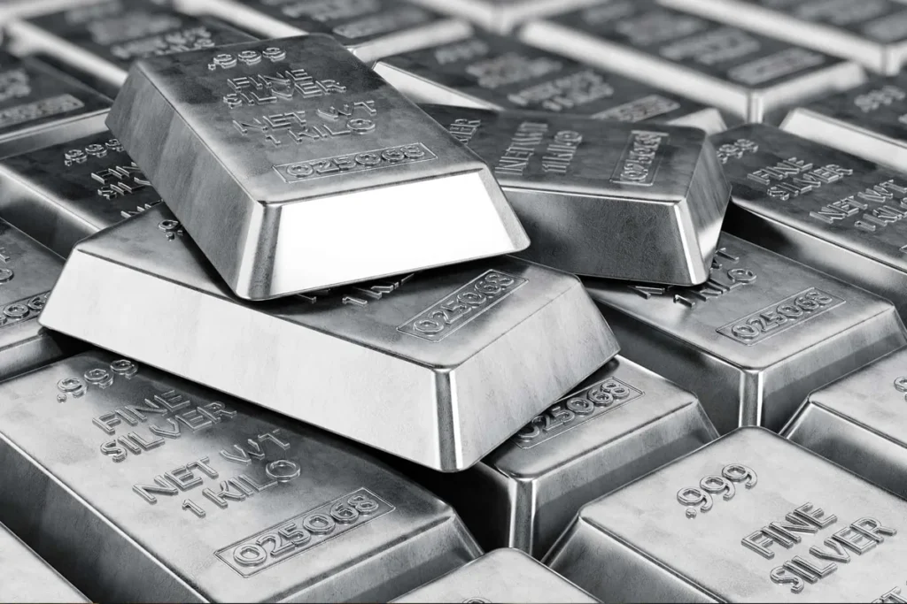 Gold and silver bars breaking record highs with a financial chart in background showing market rally driven by credit fears and global tensions."
