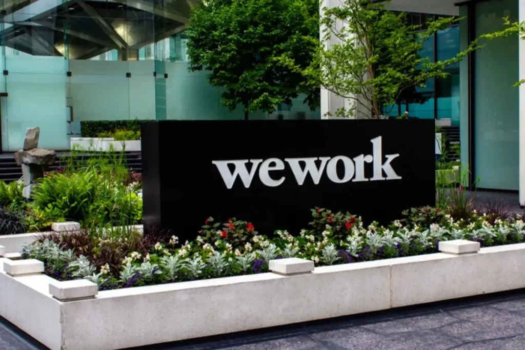 WeWork India IPO listing 2025 showing flat debut on NSE and BSE with investor reactions.