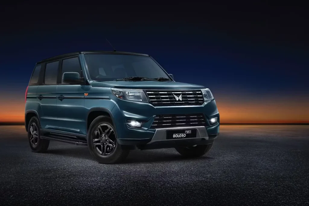Mahindra Bolero Neo 2025 SUV front three-quarter view showcasing new grille, alloy wheels, and bold design updates.