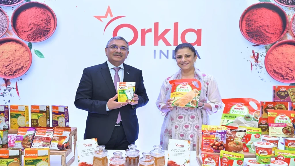 Excited investors checking Orkla India listing date and market updates after successful IPO subscription.