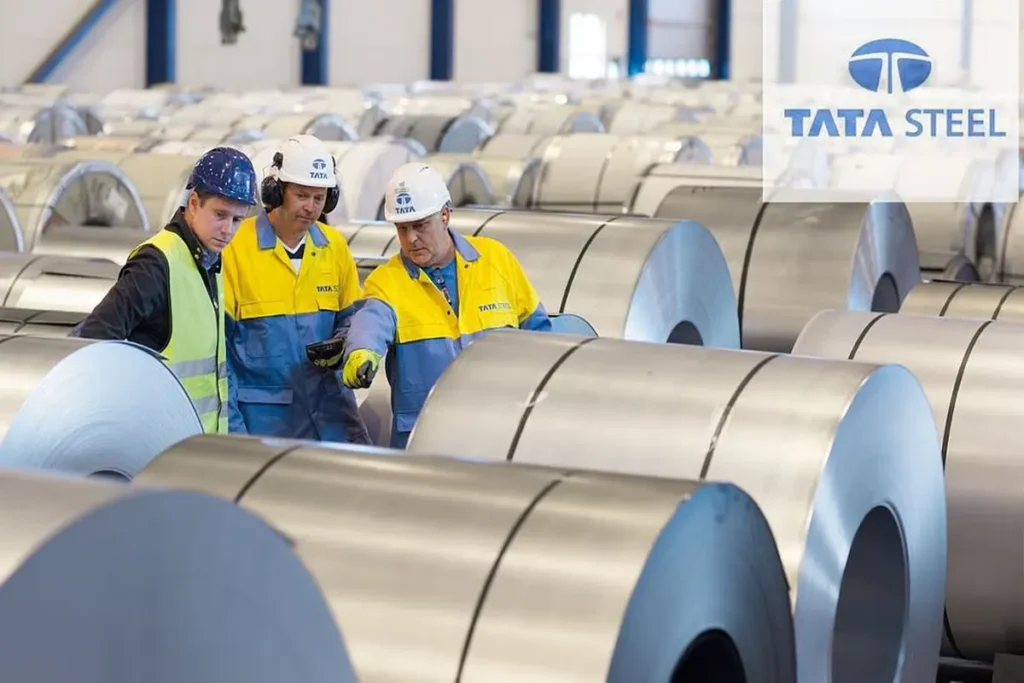 Tata Steel shares rising with green upward arrow and stock chart over steel plant background, symbolizing share price rally in 2025.