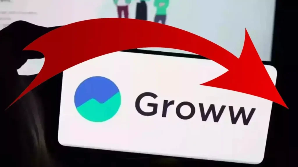 A man staring anxiously at a declining stock chart labeled ‘Groww’ on a digital screen.