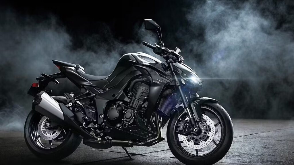 Close-up view of the 2026 Kawasaki Z1100 specs featuring its engine, frame, and LED headlamp under city lights.