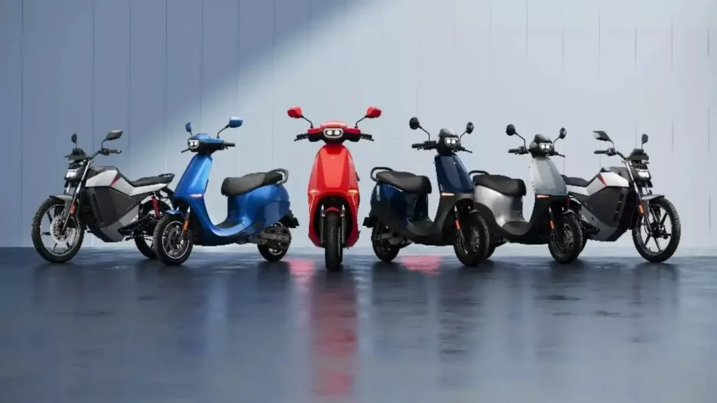 Ola Electric FY26 outlook visual showing an electric scooter with upward trend arrow representing growth and profitability goals.