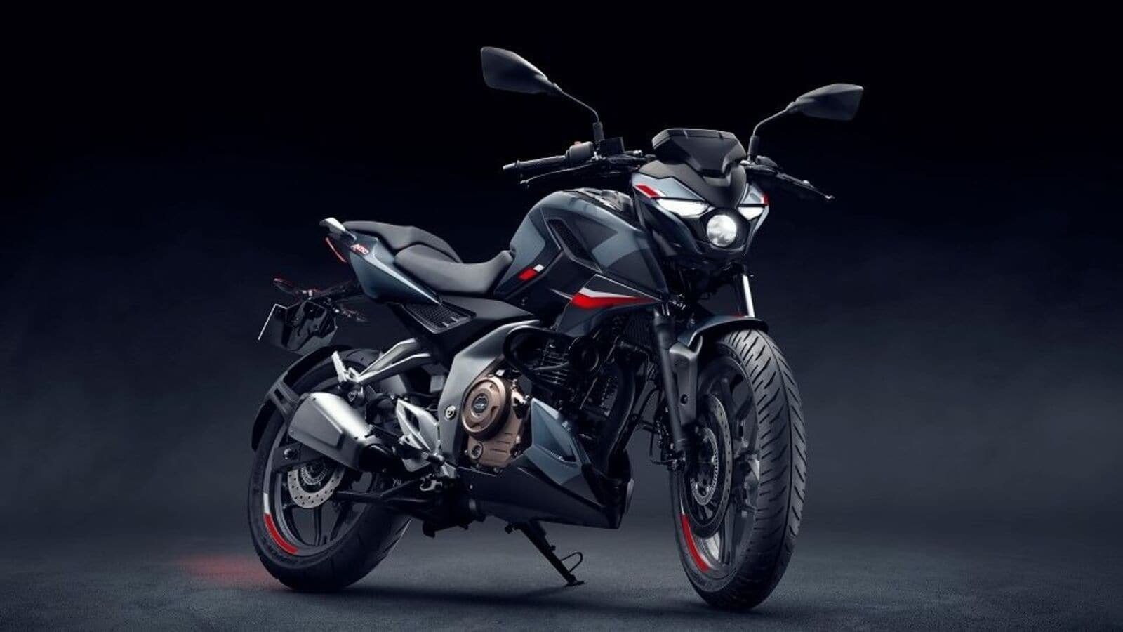 Bajaj Pulsar N160 2025 model featuring single-piece seat, USD forks, and updated graphics in a high-quality studio image.