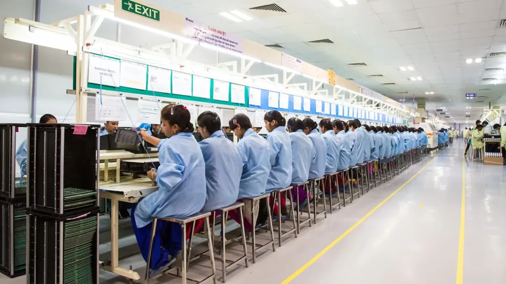 Digital stock chart and automated manufacturing line representing the growth outlook for Dixon Technologies.