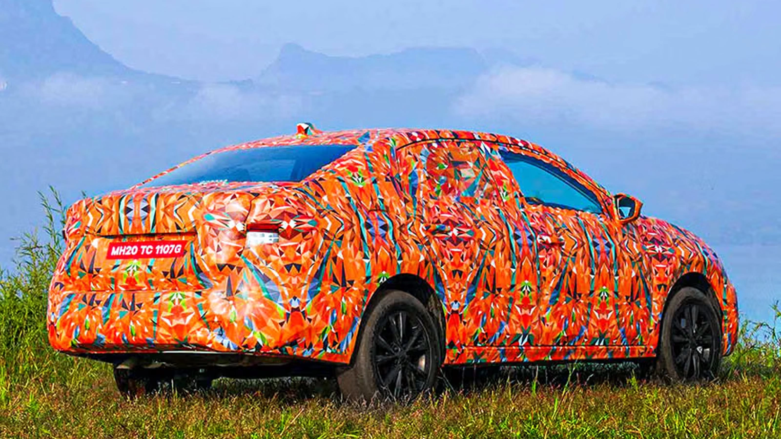 Camouflaged Skoda Slavia facelift spied testing in India, showcasing refreshed front and rear styling.